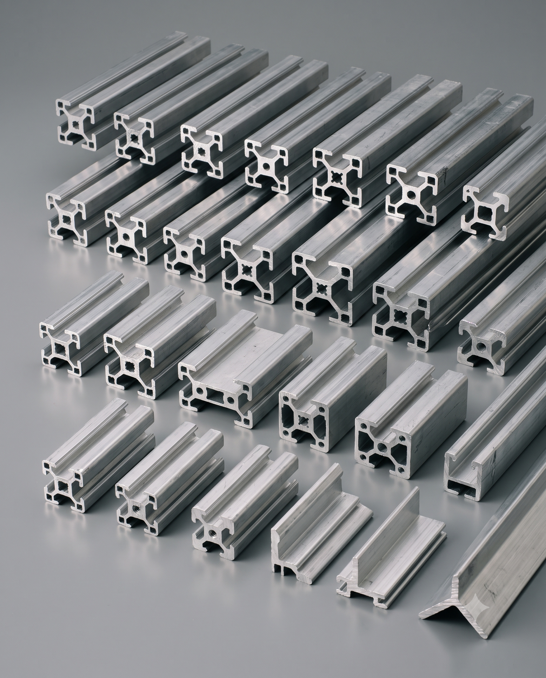 Cut-to-length aluminum extruded profiles showing their constant cross-sections